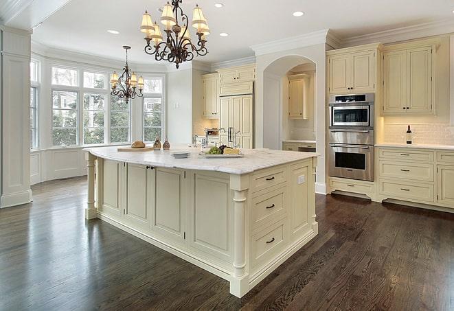 a modern kitchen with newly installed laminate floors in Mineville